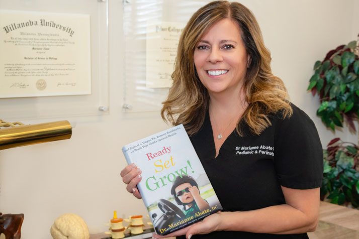 Chiropractor Rocklin CA Marianne Abate With Book