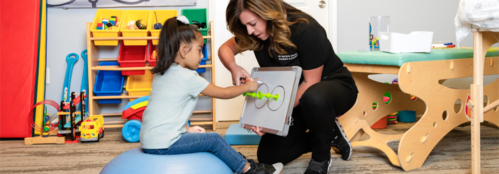 Chiropractor Rocklin CA Marianne Abate Working With Child